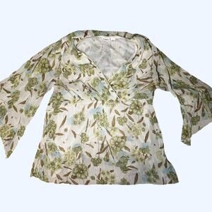 Green and white floral blouse